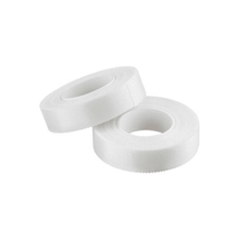Two rolls of B.Braun ASKINA Silk adhesive plaster with dimensions 2.5 cm x 5 m are stacked on a white background. Manufactured by B. Braun Deutschland GmbH & Co. KG, these skin-friendly tapes offer secure adhesion for medical or general use. Each roll features a central cardboard core that ensures easy application and reliable performance.