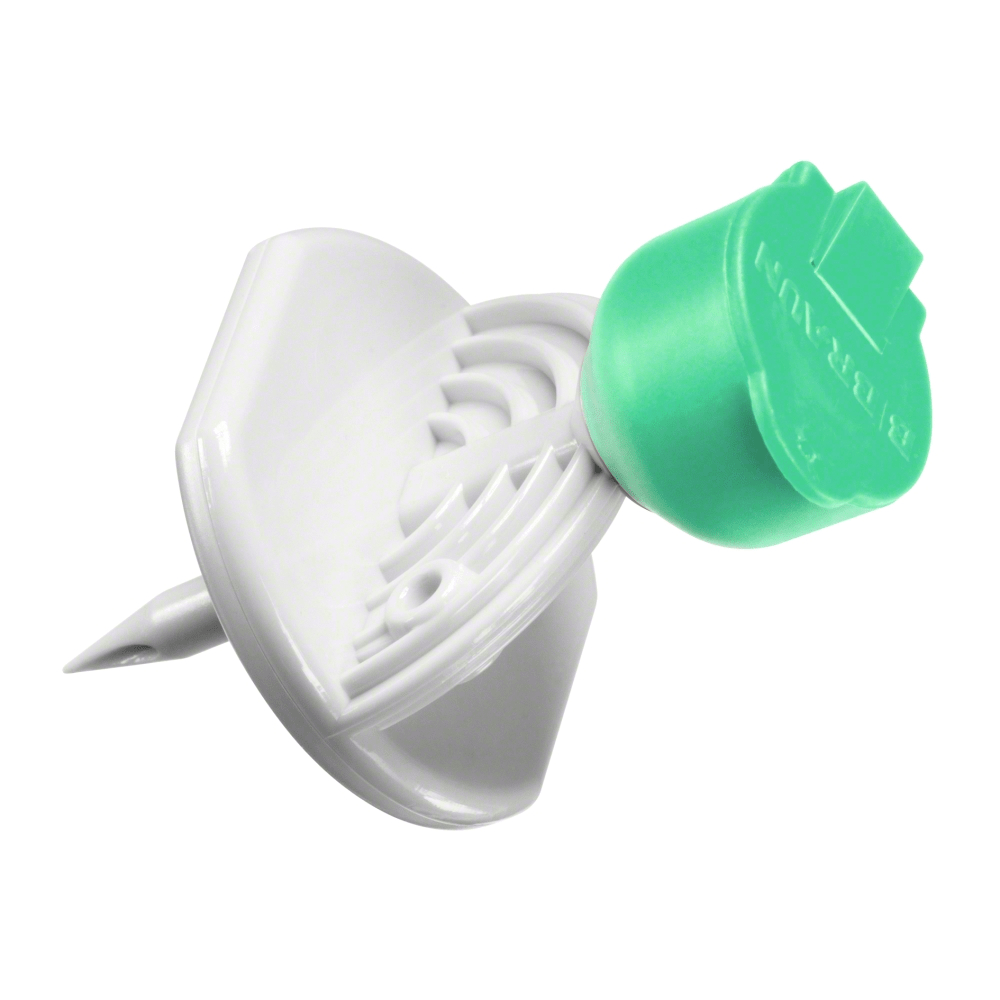 A B.Braun Mini-Spike® thumbtack from B. Braun Deutschland GmbH & Co. KG in green-white plastic design with a flat, round top and pointed end; the underside is designed to prevent deep penetration into surfaces.