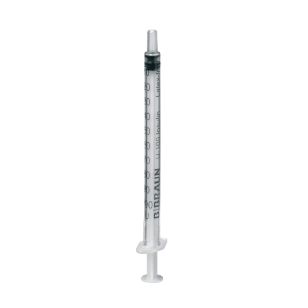A transparent B.Braun Omnifix® 100 Solo disposable insulin syringe for U-100 insulin, designed for subcutaneous insulin injection, with a black plunger cap and measurement lines on the side as well as the inscription "BBRAUN", stands upright against a plain white background.