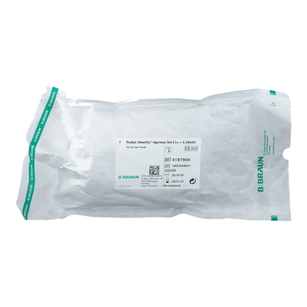 A transparent plastic packaging bears the B.Braun logo, product details and barcodes on a white background and contains the Perfusor Omnifix syringe set labeled "B.Braun ProSet Intrafix® Primeline Omnifix Syringe Set 20 ml LL | 1 piece" from B. Braun Deutschland GmbH & Co. KG.