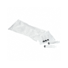 Three B. Braun ProSet Omnifix® syringes with a black plunger are partially removed from a transparent package. Next to them, on a white surface, is an empty white plastic bag reminiscent of the collective packaging of B. Braun Deutschland GmbH & Co. KG.