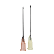 Vertically against a white background, two sharp, thin medical needles with caps are depicted. One needle with a pink cap is the B. Braun Sterican®, used for blood sampling by B. Braun Deutschland GmbH & Co. KG, while the other needle, ideal for low-pain punctures, has a transparent cap.