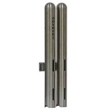 Two vertical Novocal cup dispensers double from stainless steel, each Ø 42.4 mm and for about 28 medication cups, standing side by side with the print "novocat" on one and horizontal slots on both brushed metal dispensers.
