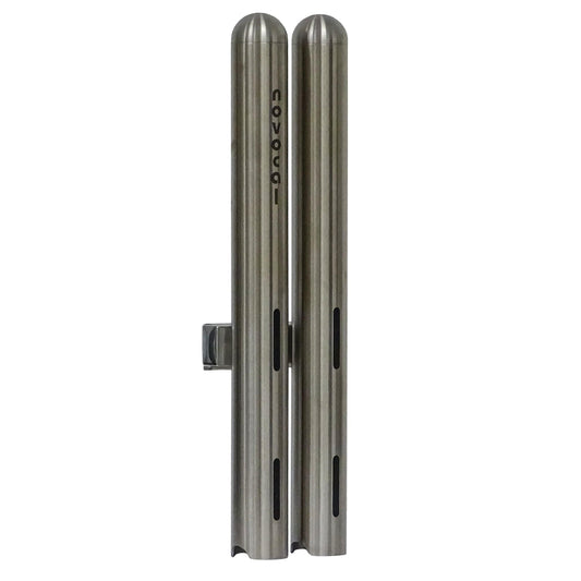 Two vertical Novocal cup dispensers double from stainless steel, each Ø 42.4 mm and for about 28 medication cups, standing side by side with the print "novocat" on one and horizontal slots on both brushed metal dispensers.