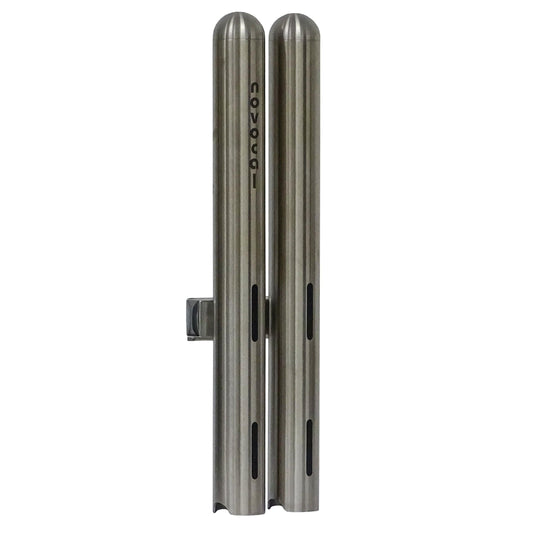 Two vertical Novocal cup dispensers double from stainless steel, each Ø 42.4 mm and for about 28 medication cups, standing side by side with the print "novocat" on one and horizontal slots on both brushed metal dispensers.