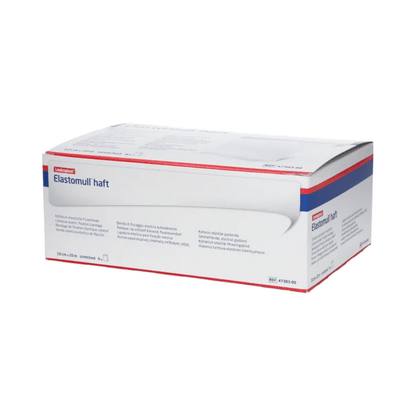 A box of BSN Elastomull® haft, a white elastic gauze bandage from BSN Medical GmbH, is displayed. The packaging features blue and red accents that highlight the label as an elastic fixation bandage. The text on the box contains product information and specifications in multiple languages.
