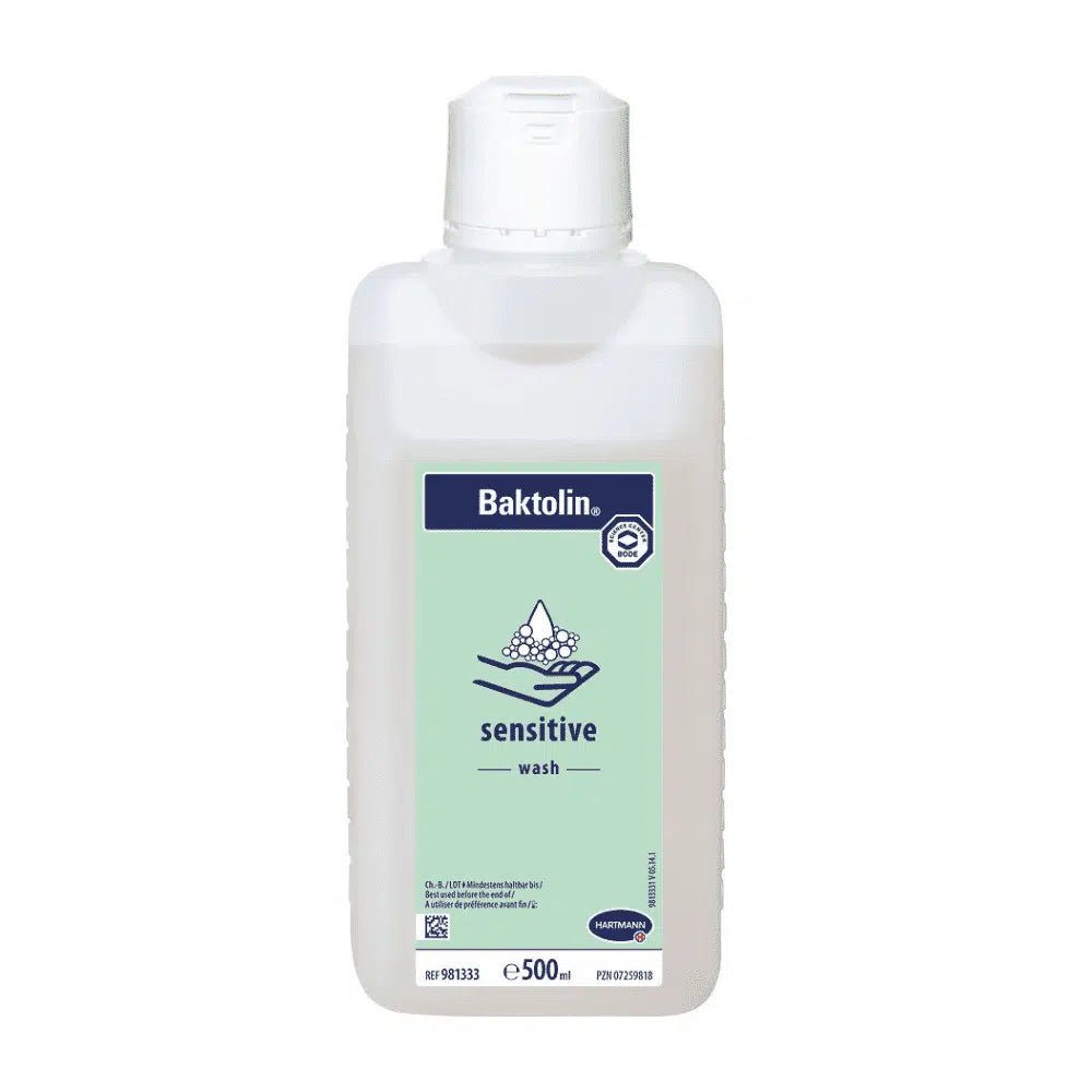 A 500 ml bottle of Hartmann Baktolin® sensitive wash lotion with a white-blue-green label featuring the Paul Hartmann AG logo and information in multiple languages. The bottle has a white flip-top cap.