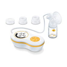 The image shows the Beurer BY 40 electric breast pump from Beurer GmbH with a digital display and control buttons, a milk collection bottle, a pump flange, and three additional bottle caps. The components are predominantly white with yellow accents thanks to vacuum technology.
