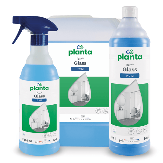 Displayed are three containers of Buzil Planta Buz® Glass P 912 Ecological Glass and Surface Cleaner from BUZIL-WERK Wagner GmbH & Co. KG, including a spray bottle, a large container, and a tall bottle. The green-white labels show an image of a room with a large window and emphasize the environmentally friendly properties.