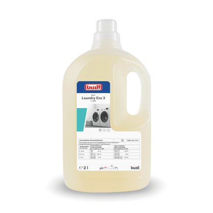 A large plastic bottle with Buzil Buz® Laundry Enz 3 L 820, an enzyme-containing liquid detergent concentrate from BUZIL-WERK Wagner GmbH & Co. KG for professional users, has a convenient carrying handle. The label features washing machine images as well as important product information. Inside, the liquid is light yellow in color.