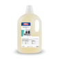 A large plastic bottle with Buzil Buz® Laundry Enz 3 L 820, an enzyme-containing liquid detergent concentrate from BUZIL-WERK Wagner GmbH & Co. KG for professional users, has a convenient carrying handle. The label features washing machine images as well as important product information. Inside, the liquid is light yellow in color.