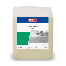Image of a 10-liter container of Buzil Total Extra G 426 high-alkaline basic cleaner, perfect for professional cleaning. The label shows the brand logo of BUZIL-WERK Wagner GmbH & Co. KG, a photo of a floor cleaning machine, as well as information such as volume, pH value, and product symbols. The translucent container is equipped with a carrying handle.