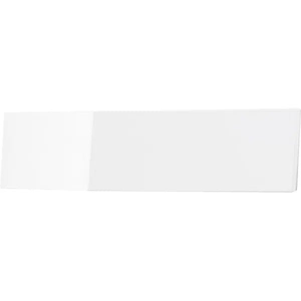 A rectangular white ceramic tile with a glossy surface, photographed on a plain white background. Its smooth, reflective surface is reminiscent of the elegant design of the CWS front panel for Paradise toilet paper by CWS.