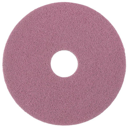 A round, pink Diversey Twister Pad Pink for vinyl floors from Diversey Deutschland GmbH & Co. OHG with a textured surface and central hole, designed for vinyl floors, seen from above on a white background.