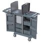 The DI PROTECT TROLLEY LARGE from Diversey Deutschland GmbH & Co. OHG is a large, enclosed cart (1 piece) with multiple shelves, two lid containers, a central bag section, and four wheels for safe mobility during daily cleaning tasks.