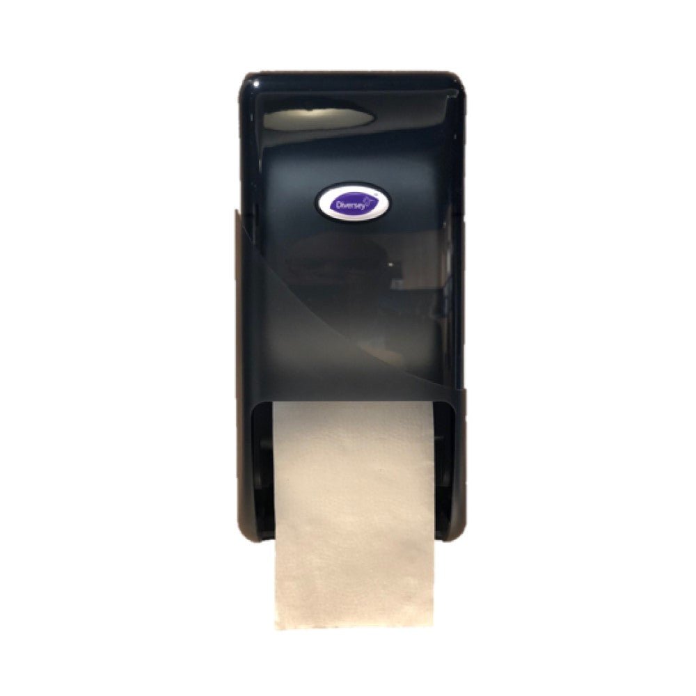 A black plastic DI system roll dispenser for toilet paper from Diversey Deutschland GmbH & Co. OHG, wall-mounted with visible white paper hanging below and an oval "Diversey" logo on the front, ideal for public restrooms.