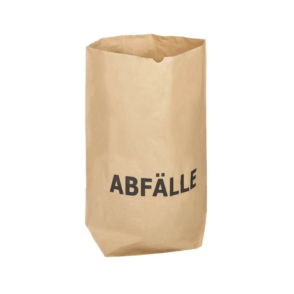 A durable and environmentally friendly DEISS paper bag with the striking print "WASTE" stands upright in front of a simple white background. This compostable bag from EMIL DEISS KG (GmbH + Co.) is specially designed for waste.