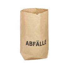 A durable and environmentally friendly DEISS paper bag with the striking print "WASTE" stands upright in front of a simple white background. This compostable bag from EMIL DEISS KG (GmbH + Co.) is specially designed for waste.