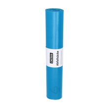 A rolled-up blue DEISS Standard® garbage bag made of LDPE with a white label featuring text and logo indicating the Blue Angel environmental certification.