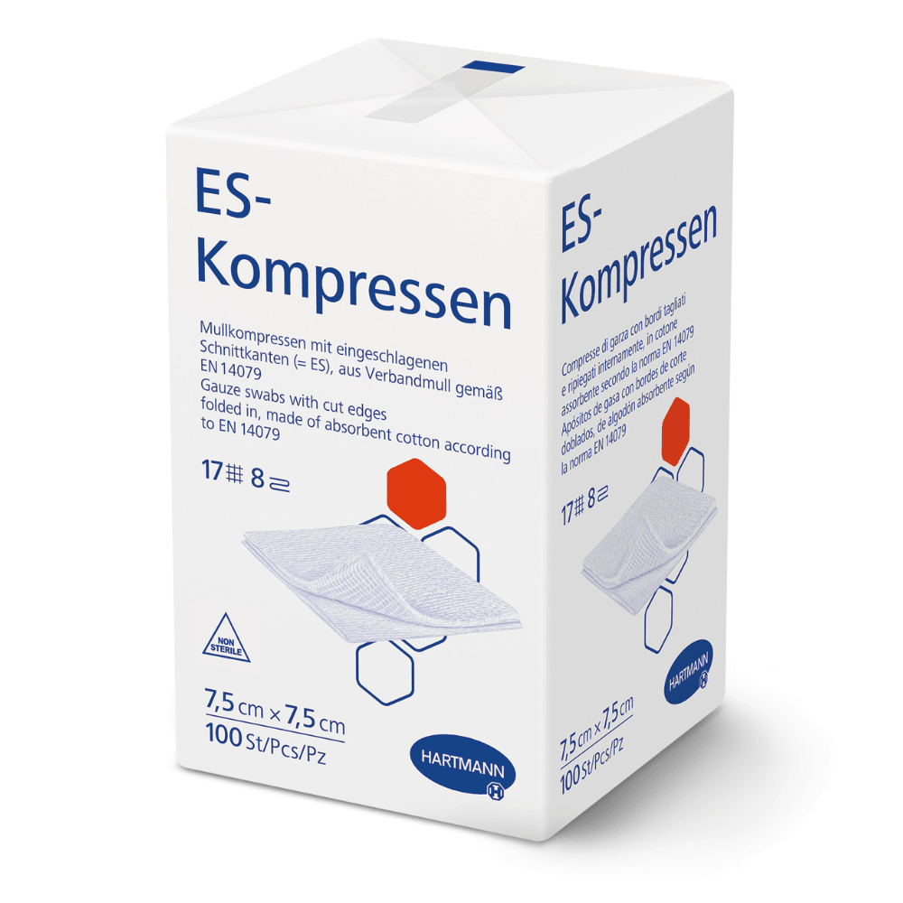 A white box labeled "Hartmann ES compresses various sizes, non-sterile" by Paul Hartmann AG shows product information in German, dimensions 7.5 x 7.5 cm, 100 pieces, an illustration of gauze compresses for wound care, and the Hartmann logo at the bottom.