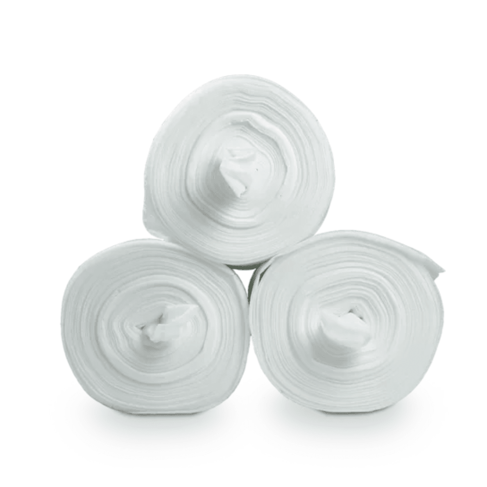 Three large white rolls of fabric, specifically Dr. Schumacher Decso Wipes RT, non-woven cloth rolls, are stacked in a triangular formation against a plain white background. Each roll is tightly wound and reveals its inner hollow core in the middle.