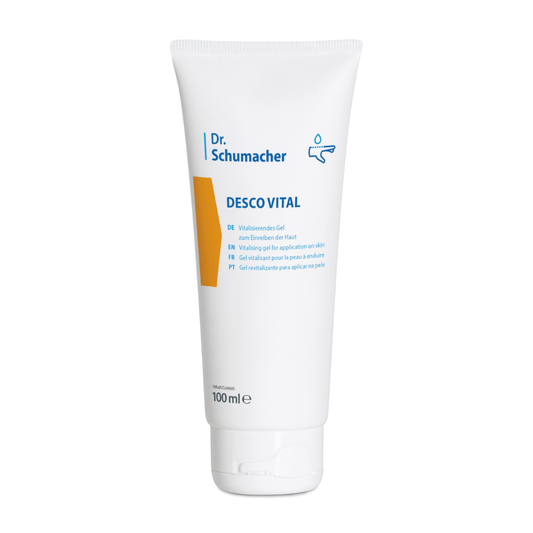 A white 100 ml squeeze tube labeled "Dr. Schumacher Desco Vital Hydro Gel" from Dr. Schumacher GmbH. The tube features a multilingual text that indicates it is a revitalizing hydrogel for application on the skin. The design includes a yellow-orange accent and a simple drop symbol, making it ideal for sports massage.