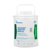 A white resealable package of Dr. Schumacher Descosept Sensitive Wipes XL - disposable wipe dispenser by Dr. Schumacher GmbH with green-blue branding. The package contains 120 disinfectant wipes for quick disinfection in patient-near areas and features a carrying handle on top for easy transport.