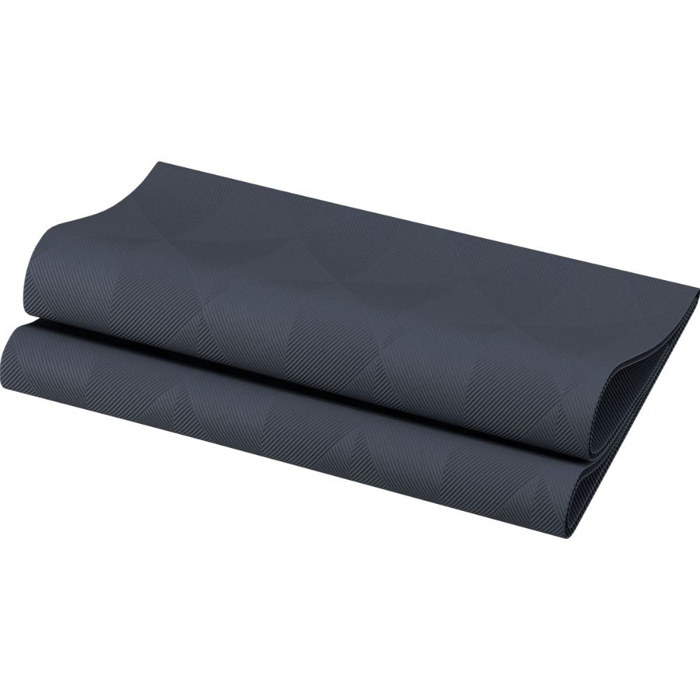 A finely folded black yoga mat with a subtle geometric pattern rests on a white background, next to the Duni Elegance Napkins Crystal 48 x 48 cm 1/4 fold Crystal by Duni GmbH for an extra touch of sophistication.
