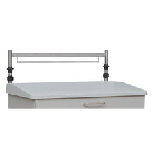 A close-up of a white medical cart with a metal drawer handle and an adjustable Novocal Euro rail (single, for rear wall, height adjustable) from Novocal, attached at the back along with a plastic edge and an infusion pole.