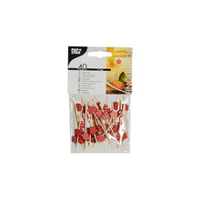 On a simple white background, a pack of 40 PAPSTAR finger food picks in various designs and a length of 7 cm is depicted. The bamboo skewers with red ornaments from PAPSTAR GmbH are shown on the packaging and placed in a bowl, ideal for serving appetizers or small snacks.
