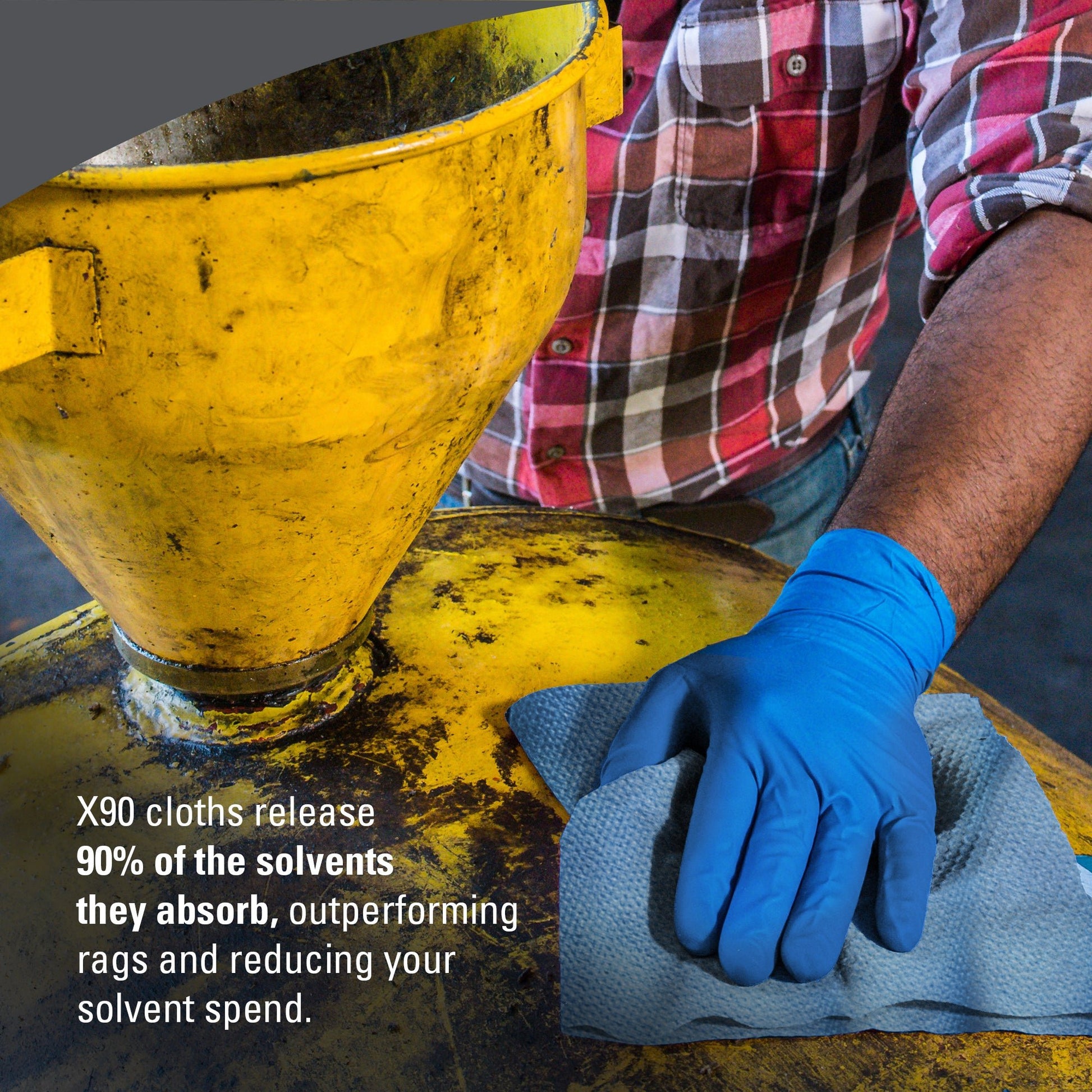 A person in a blue glove wipes a yellow tank with a gray cloth. The text overlay promotes the WypAll® X90 PowerClean - BRAG™ Box from Kimberly-Clark GmbH, highlighting the 90% cleaning solution and solvent savings. 1 box, 136 sheets.