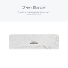 The Kimberly-Clark Professional™ Icon™ Dispenser Faceplate - SRBH (32.39 cm x 10.80 cm x 3.18 cm) from Kimberly-Clark GmbH features a white and light gray marble pattern, a central Icon™ label, and "Cherry Blossom" accents for a soothing look.