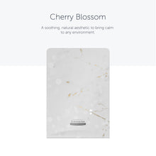 The rectangular Kimberly-Clark Professional™ Icon™ Dispenser Faceplate-eSkinCare (20.32 x 27.30 x 3.81 cm) from Kimberly-Clark GmbH features a white-light gray marbled design with gold accents, giving any washroom a soothing, elegant touch.
