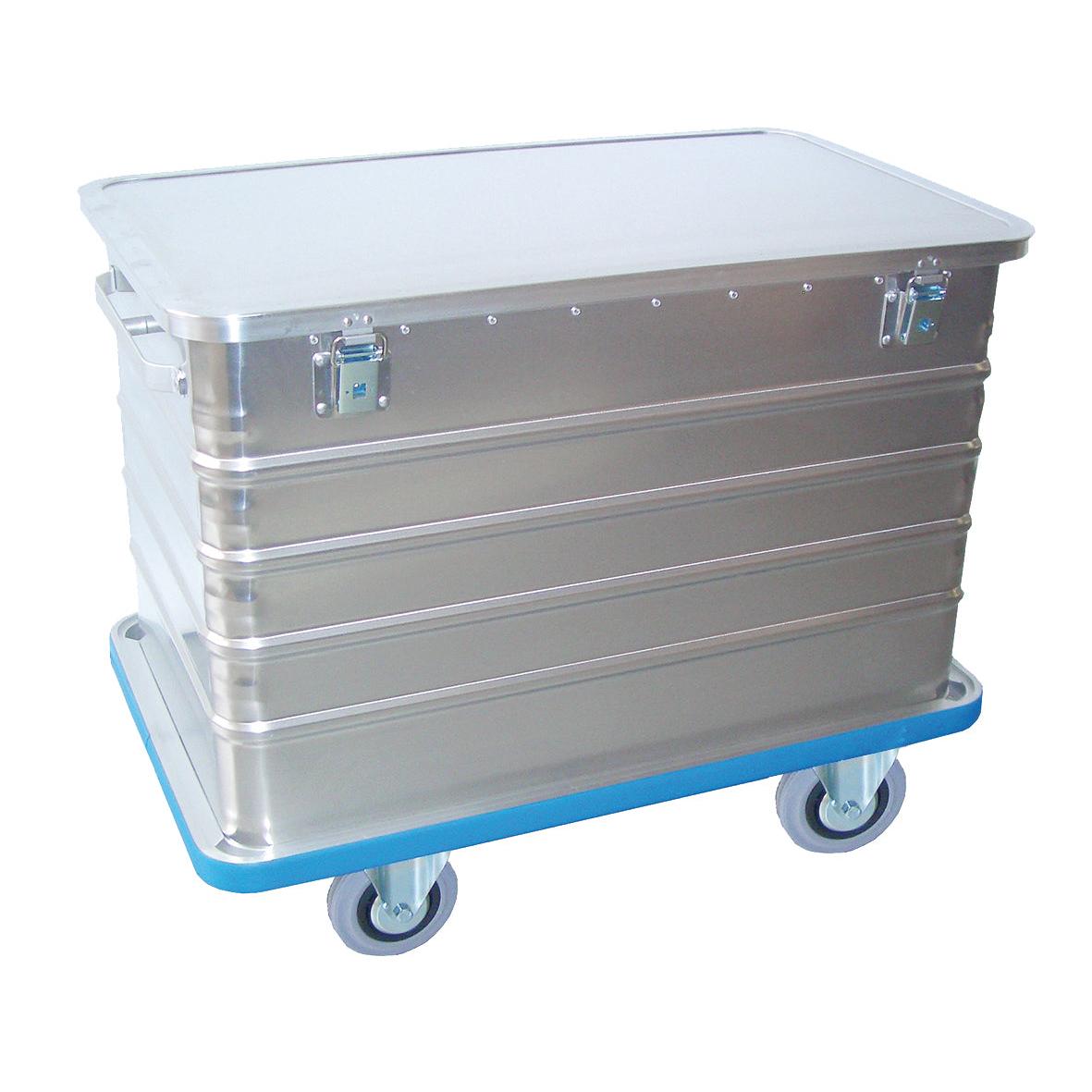 A Novocal transport container made of aluminum with a hinged lid, all-around impact protection, and two locks, mounted on a blue rolling base for easy mobility.