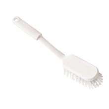 The Haug Bürsten KG STIELSCHEUERBÜRSTE with transparent, stiff PBT bristles (ø 0.50mm), 290x45x24mm, has a textured handle with a hanging hole and an oval head. Photographed on a solid white background.