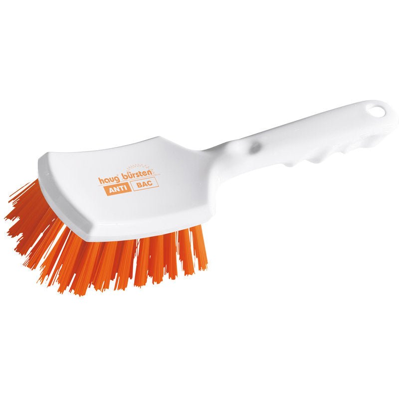 Haug Bürsten KG ANTI BAC handle brush made of white plastic with a slightly curved handle and stiff orange PBT bristles (ø 0.50 mm) angled for scrubbing. "ANTI BAC" and "Haug Bürsten" are printed on the brush head. Size: 260x72x35mm.