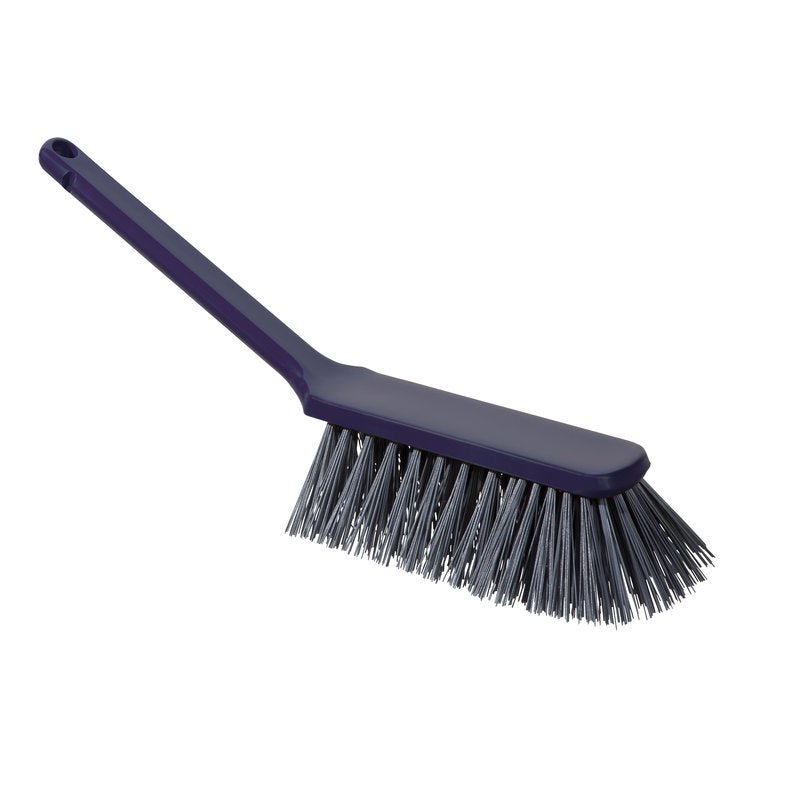 The METDEC PREMIUM HAND BROOM from Haug Bürsten KG has stiff gray and blue PBT bristles, a long handle, and measures 310x40x45mm. Pictured being held in the hand against a white background.