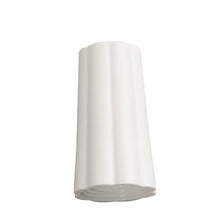 A white, vertically standing ceramic vase with subtle grooves, inspired by the design of the Haug Bürsten KG's EXTERNAL NUT COVER DIAMETER 25MM WHITE 74XØ 42MM, photographed against a simple white background.