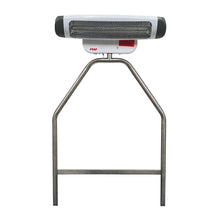 On the Novocal stainless steel bracket for radiant heaters, there is a white-gray electric heater with a metal grid cover and a red "reer" logo mounted, which is ideal as an accessory in the changing area for secure attachment to a changing trolley.