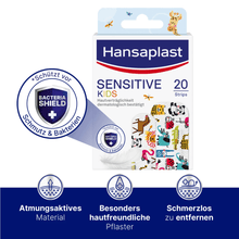 A pack of Hansaplast Children's Plaster Sensitive - 20 plasters by Beiersdorf AG with colorful, child-friendly animal design. The packaging highlights hypoallergenic, breathable material and easy removal, with symbols emphasizing protection.