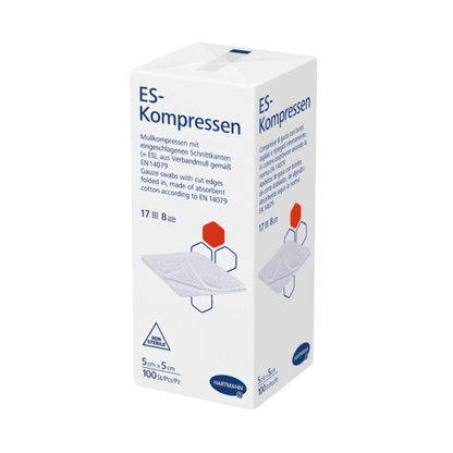 A product image of a box of Hartmann ES compresses in various sizes, non-sterile, by Paul Hartmann AG, which are sterile gauze compresses. The box contains text in German and symbols indicating the product size.