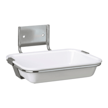 Image of a wall-mounted soap dish. The soap dish, Hartmann drip tray for wall mounting, for Eurospender 1 & 1plus | Piece (1 piece) by Paul Hartmann AG, is rectangular with white sides and a stainless steel frame. It is attached to a metal bracket with two holes for wall mounting. The design is minimalist and functional, suitable for medical facilities.