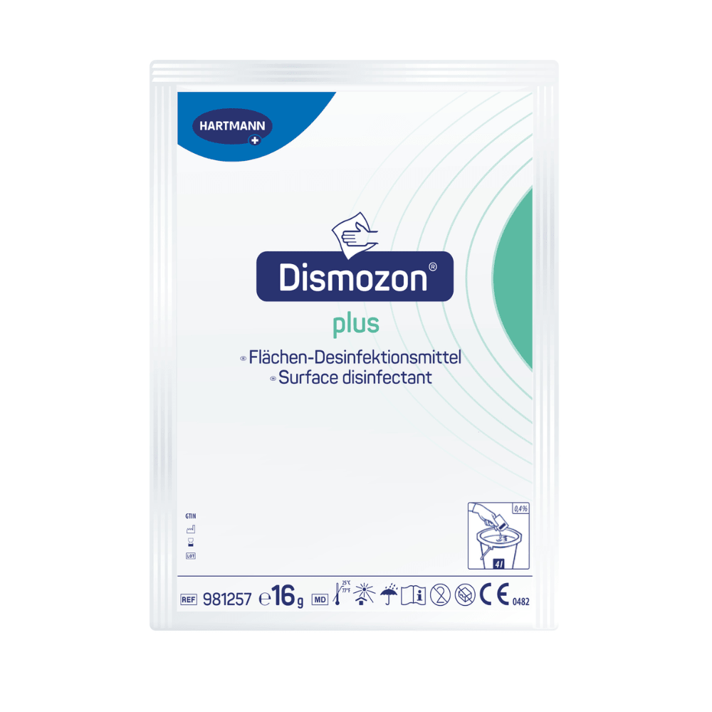 The image shows a pack of Hartmann Dismozon® plus disinfectant cleaner from Paul Hartmann AG. The packaging design is predominantly white with blue and green accents and includes instructions and symbols for use. Each pack contains 16 grams of oxygen-active granules, a box contains 100 sachets.