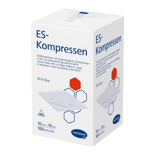 A box of Hartmann ES compresses in a paper bag from Paul Hartmann AG, medical gauze compresses for wound care, with images of the product and text in German with size and quantity information.