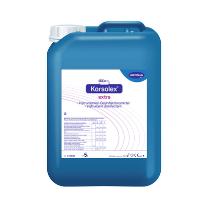 A blue 5-liter container with "Hartmann Korsolex® extra instrument disinfectant from Paul Hartmann AG" with printed brand name and medical application instructions on the label.