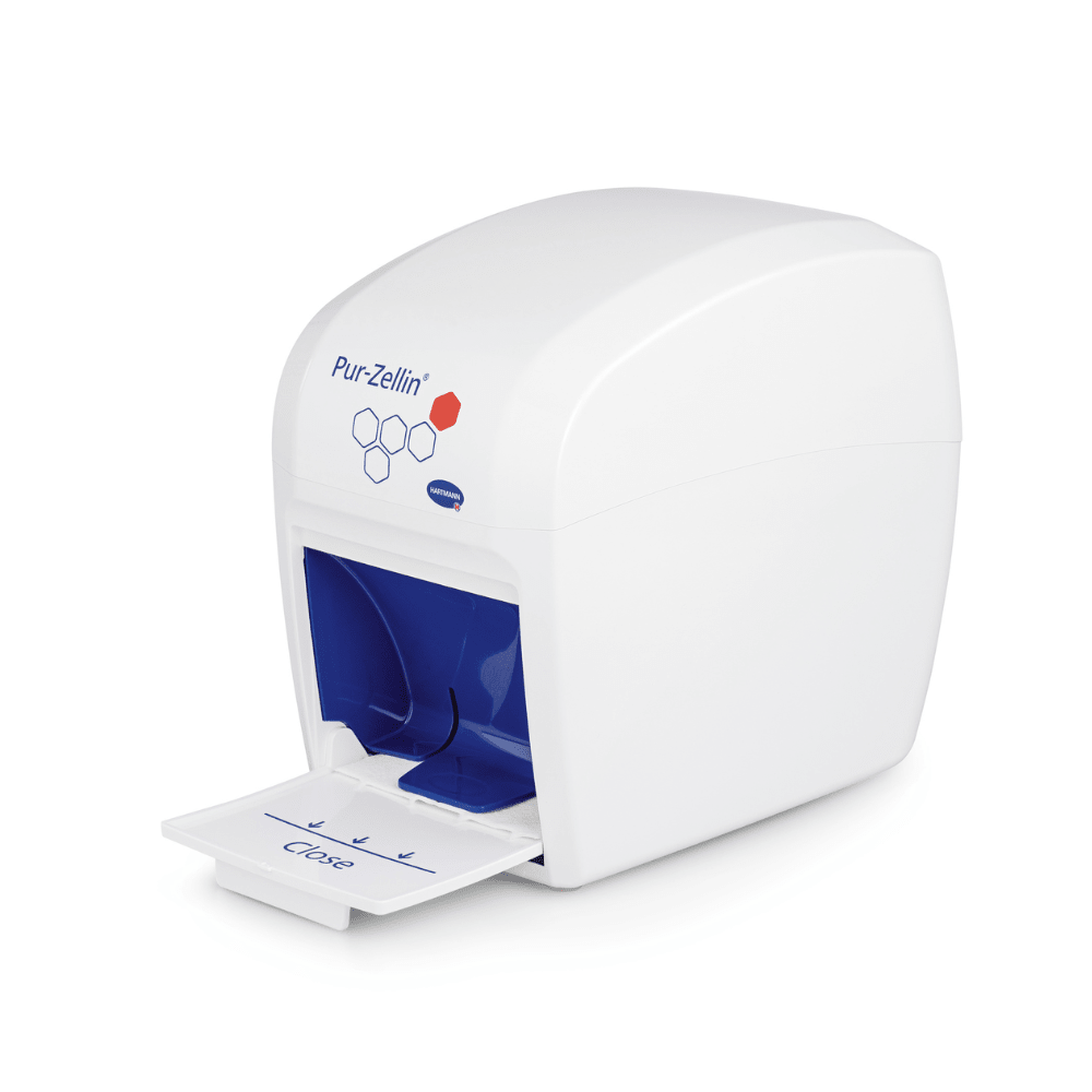 A stylish, white, box-shaped Hartmann Pur-Zellin® box with a blue interior features a small pull-out compartment labeled "Close". The top is adorned with the brand name "Paul Hartmann AG", hexagonal patterns, and a red drop symbol. This elegant item is ideal for the efficient dispensing of cellulose swabs.
