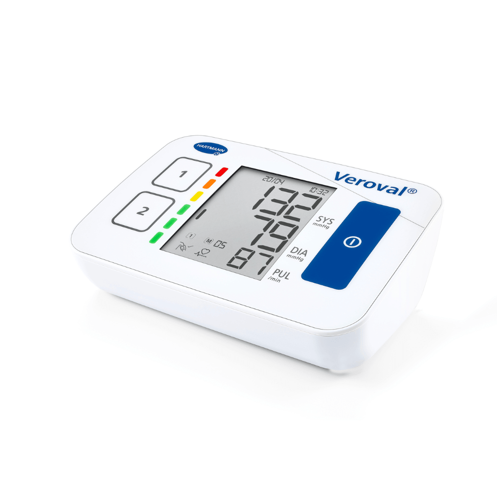A digital blood pressure monitor Veroval® Compact by Paul Hartmann AG with a large display, showing systolic and diastolic values, heart rate, and other indicators. The device is set against a white background.
