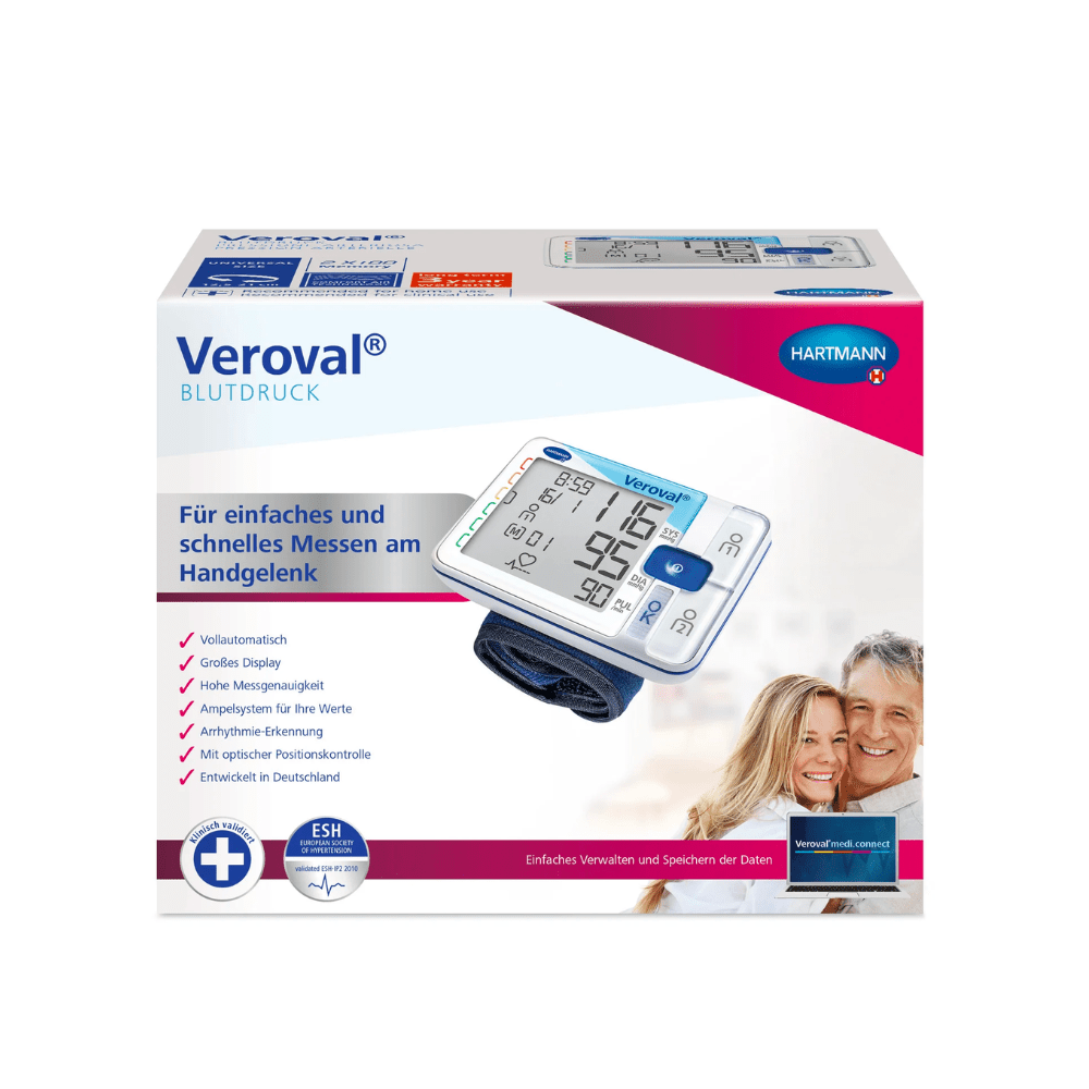 Packaging of the Hartmann Veroval® wrist blood pressure monitor with digital display unit and cuff, featuring images of a smiling elderly couple and product information in German.