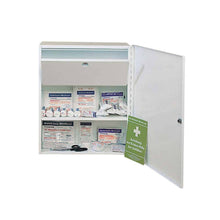 A white metal first aid cabinet, the *Holthaus Medical First Aid Cabinet MEDICUS*, displays various medical items neatly arranged on two shelves when the door is open. The items include adhesive bandages, gauze compresses, antiseptic wipes, scissors, a first aid manual, and a lockable medication compartment.
