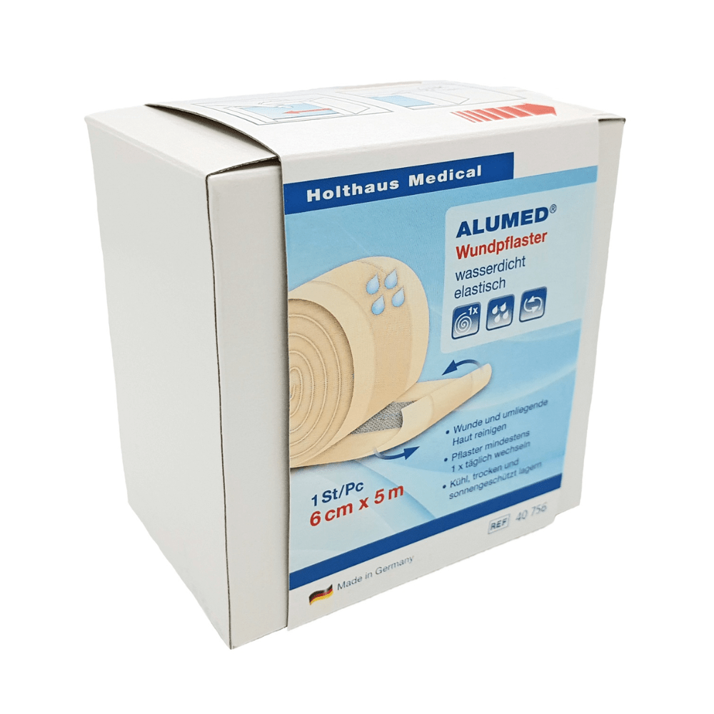 A white box of Holthaus Alumed® wound plaster, 6 cm x 5 m from Holthaus Medical GmbH & Co. KG shows an image of the plaster roll and states that it is hypoallergenic, waterproof, and elastic. The text on the box of the water-repellent wound plaster is mainly in German. The product is made in Germany.